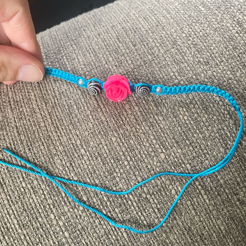 Bright blue tie on bracelet